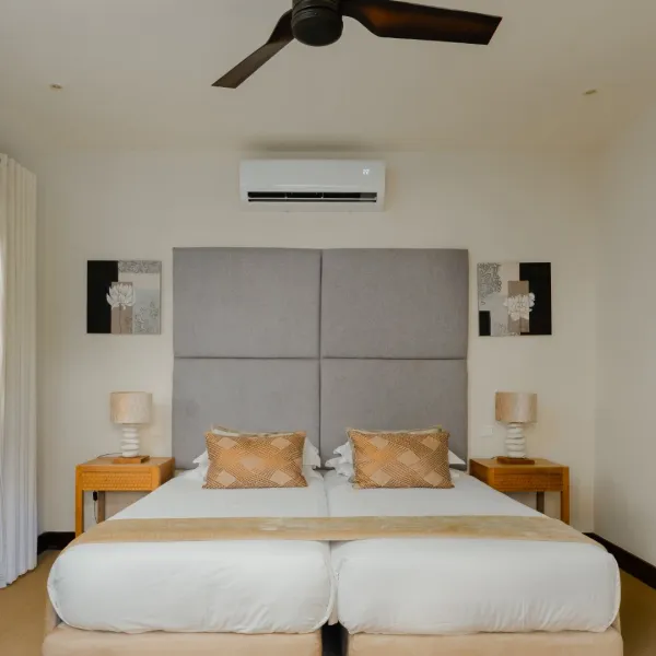 Front-facing view of a top floor bedroom in a luxury three-bedroom villa with contemporary design