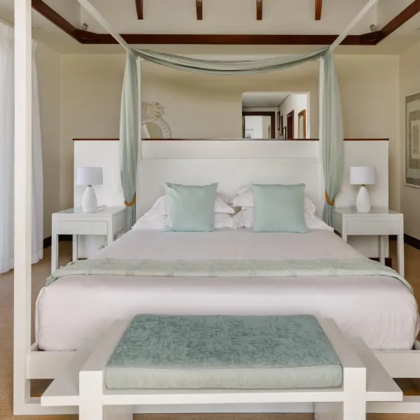Front-facing view of a canopy bed bedroom in a luxury four-bedroom villa