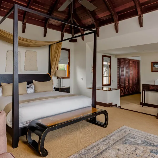 Canopy bed bedroom in a luxury four-bedroom villa with elegant interior design