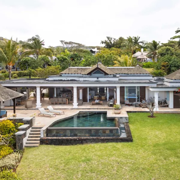 Exterior landscape view with poolside of a luxury 4-bedroom villa