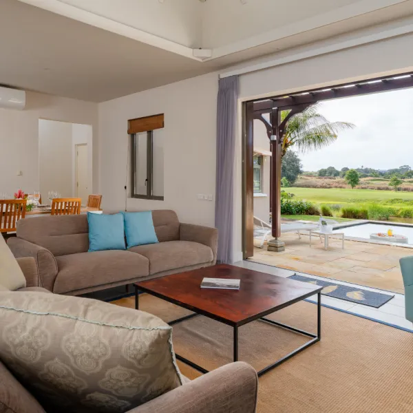 Luxurious living room with pool view in a 4-bedroom villa