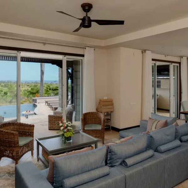 Wide-angle view of the living room in a luxury four-bedroom villa with contemporary furnishings