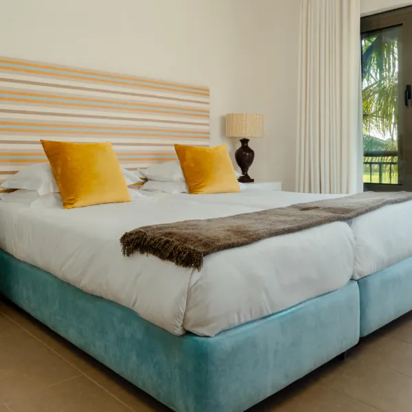 Side view over the top floor bedroom of a luxury four bedroom villa 