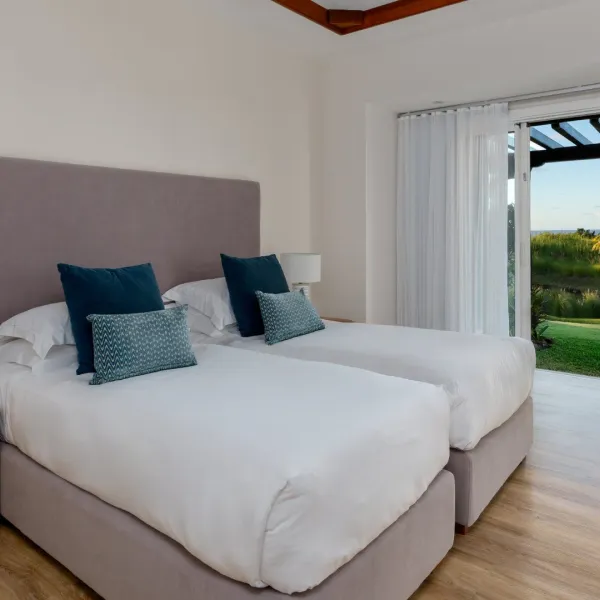 Left exterior view of a two-bedroom section in a luxury 4-bedroom villa