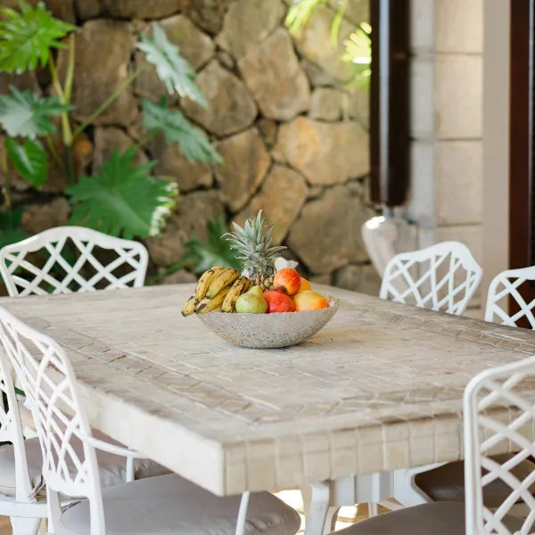 Outdoor terrace of a 3-bedroom villa overlooking the pool and ocean at Heritage The Villas, Mauritius