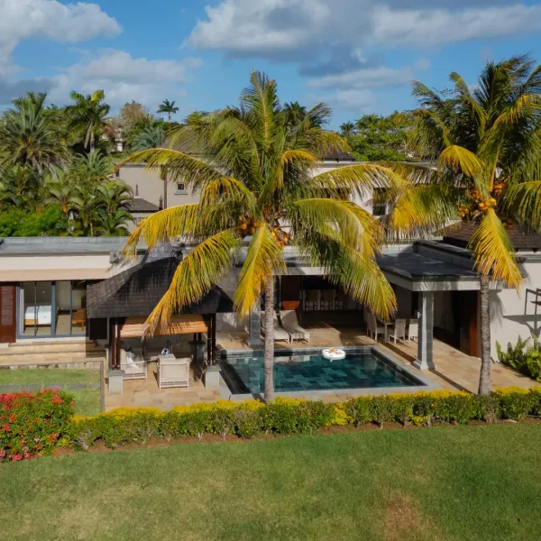 Exterior View over a 4 Bedroom Villa with Lush Green Background
