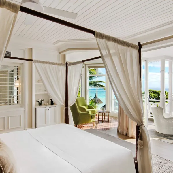 junior beachfront adult only suite bedroom with ocean view at heritage le telfair