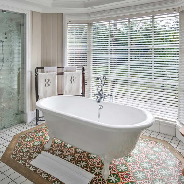 junior suite garden view bathroom on upper floor with bathtub