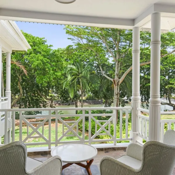 junior suite with garden view on upper floor with river facing balcony