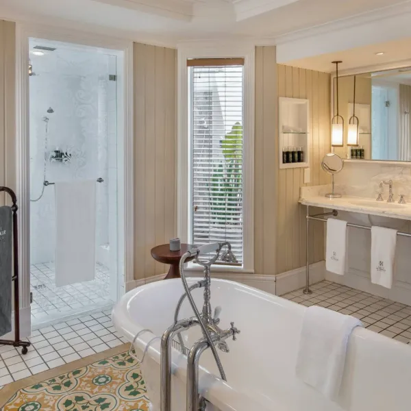 ocean beachfront room with modern bathroom at heritage le telfair mauritius