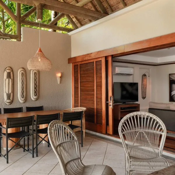 beachfront villa opening directly to a private outdoor entertainment area