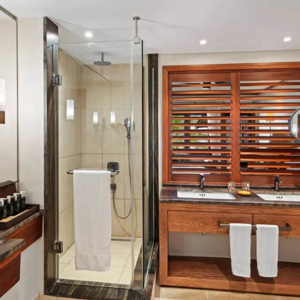 bathroom with amenities and african inspired decor on upper floor heritage awali
