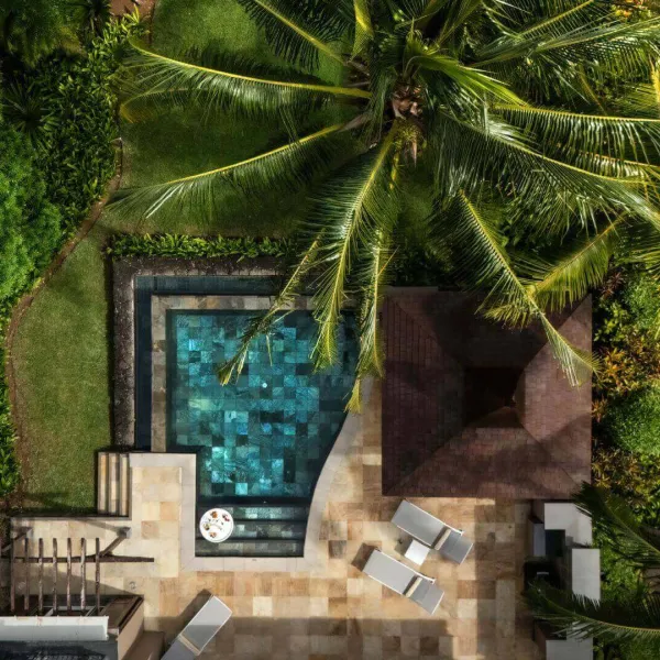 Pool area with garden view at Heritage The Villas Mauritius