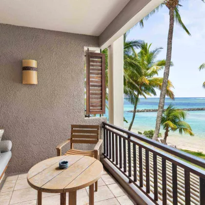 beachfront room with open balcony overlooking on the blue ocean heritage awali 