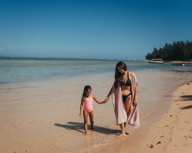 Family Walking on Beach in Mauritius - Heritage Resorts