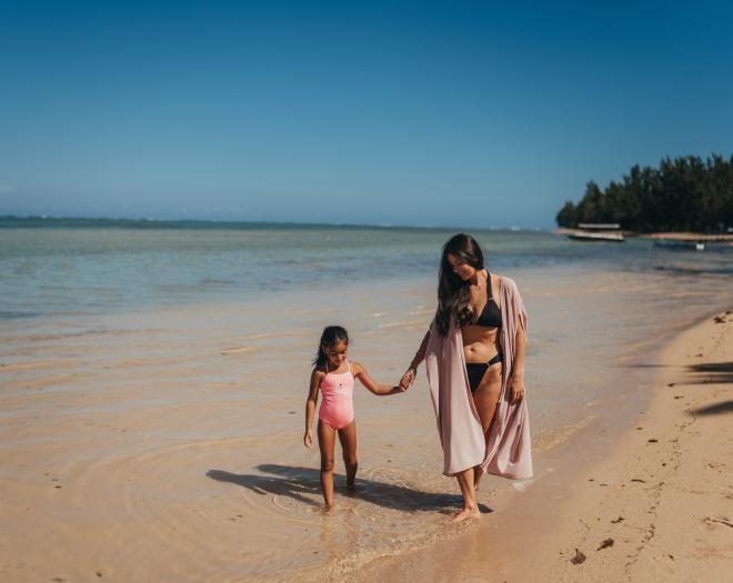 Family Walking on Beach in Mauritius - Heritage Resorts