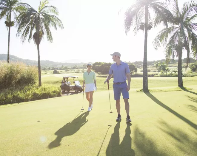 couple playing golf at Heritage Awali Golf & Spa Resort