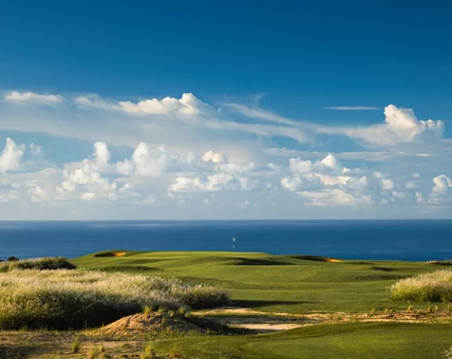 View over La Réserve Golf Links with sea backdrop in Mauritius