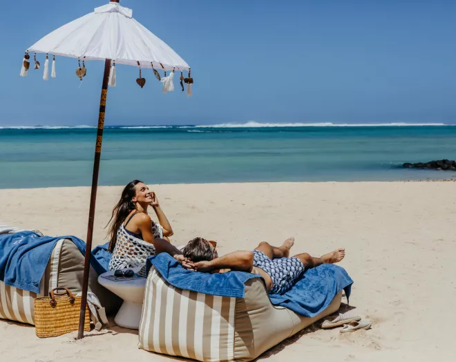 couple chilling on beach heritage resorts mauritiusi
