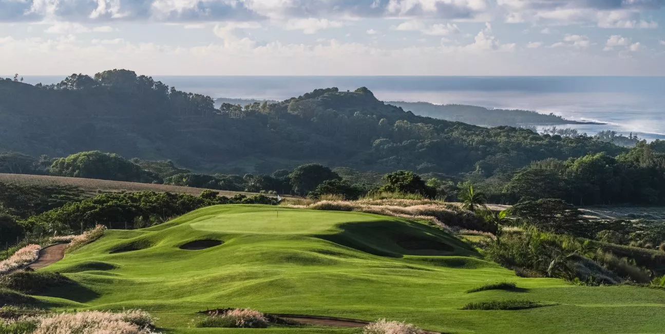 La Réserve Golf Links overlooking the ocean with lush forest backdrop in Mauritius