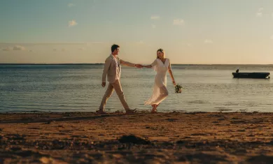 couple wedding walk on Heritage Awali beach 
