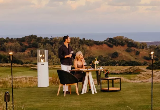 Couple enjoying a sunset dinner at La Réserve Golf Links, Mauritius