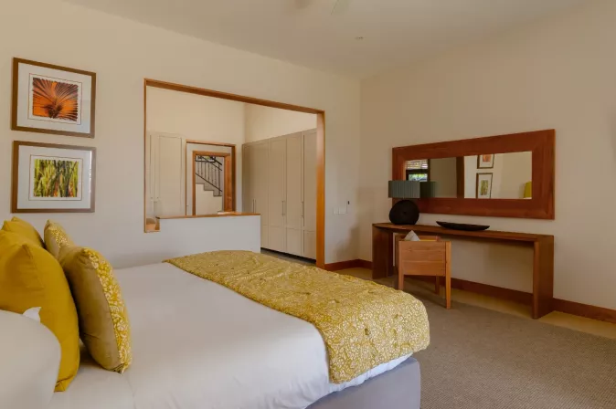 villa baume bedroom with king size bed and poolview at heritage the villas