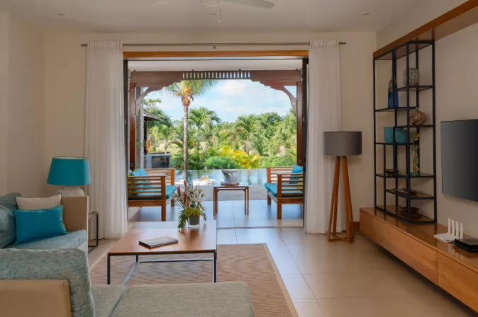 villa baume dining area with pool view 
