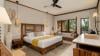 Side view of a deluxe beachview bedroom featuring modern furnishings